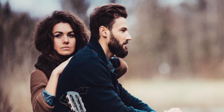 couple looking serious outdoors 
