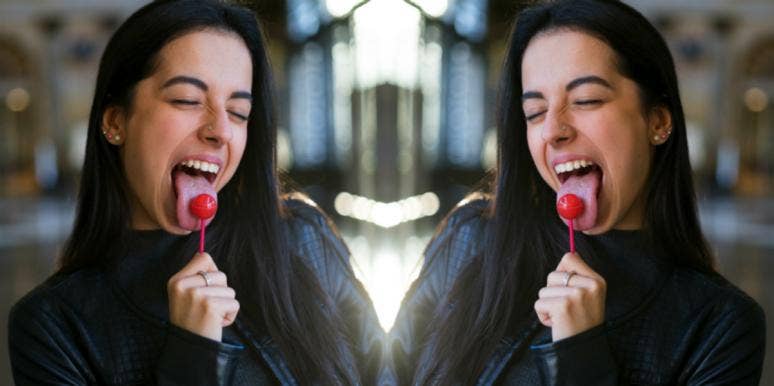 woman with lollipop in her mouth