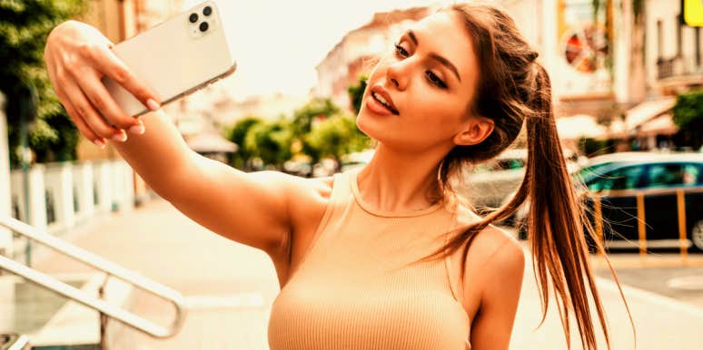 beautiful woman taking a selfie