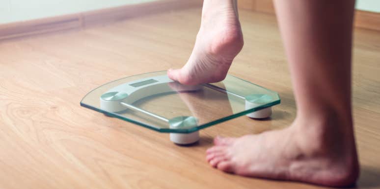 My Doctor Said I Was Obese Based Only On My BMI woman stepping on scale