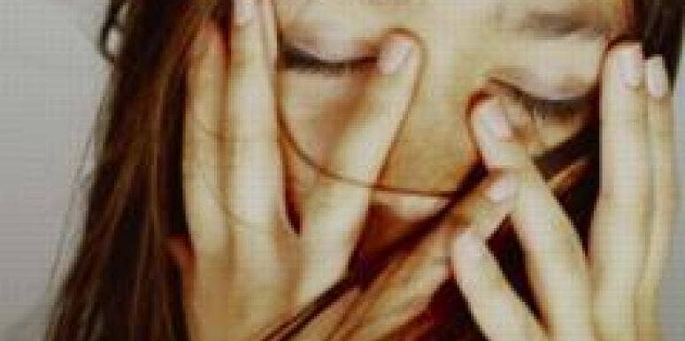 Can A Formerly Abusive Husband Change? upset woman covering face
