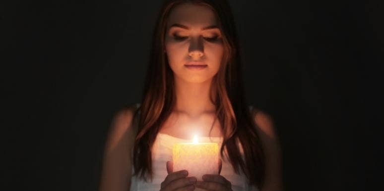 Why You Need To Stop Letting Him Dim Your Light woman with candle