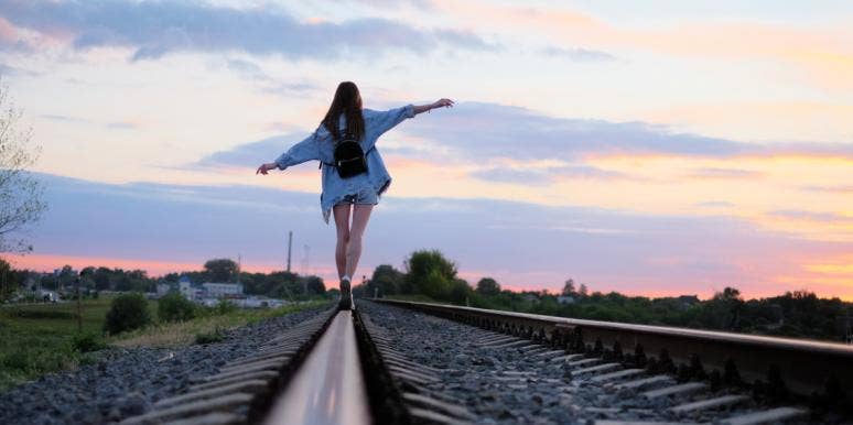 I Don't Need A Man, But That Doesn't Mean I Can't Want One woman walking on train tracks