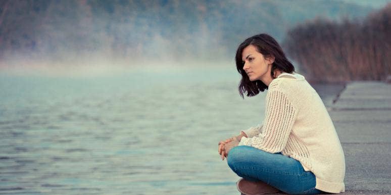 The Real Reason I Can't Trust Guys When It Comes To Relationships woman sitting on dock