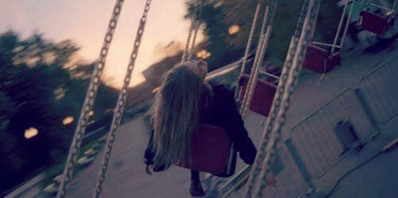 woman swinging at amusement park