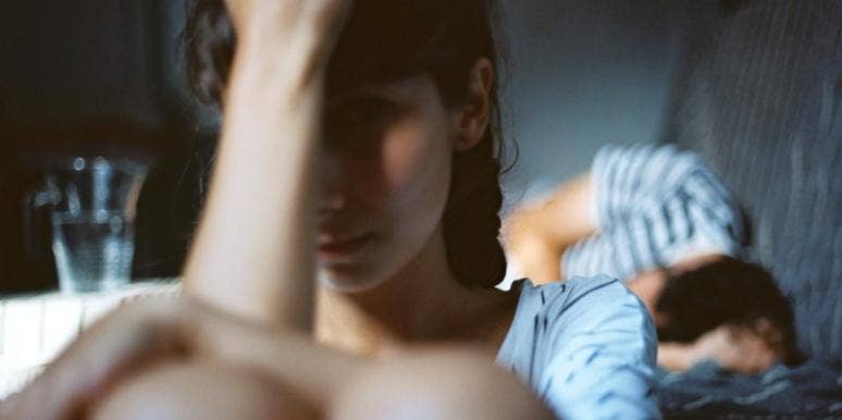 The Downward Spiral Of Being In An Abusive Relationship woman hiding herself from man