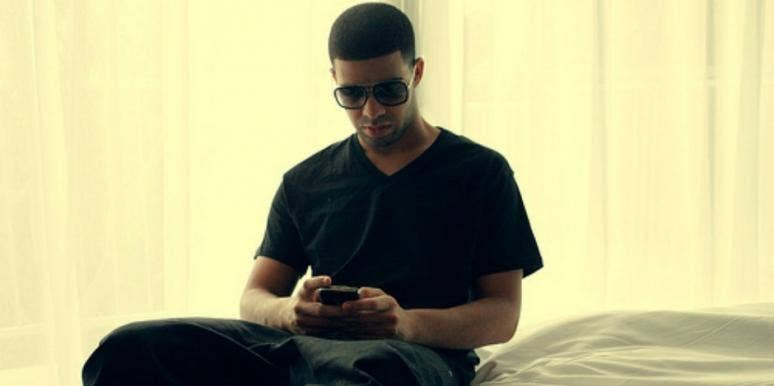 Drake using a phone