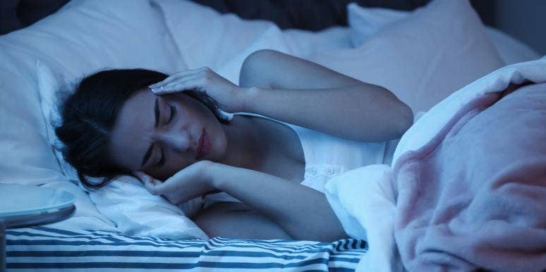 Dream About Your Partner Cheating On You? What It Means, Why It's Happening & What To Do About It woman having trouble sleeping
