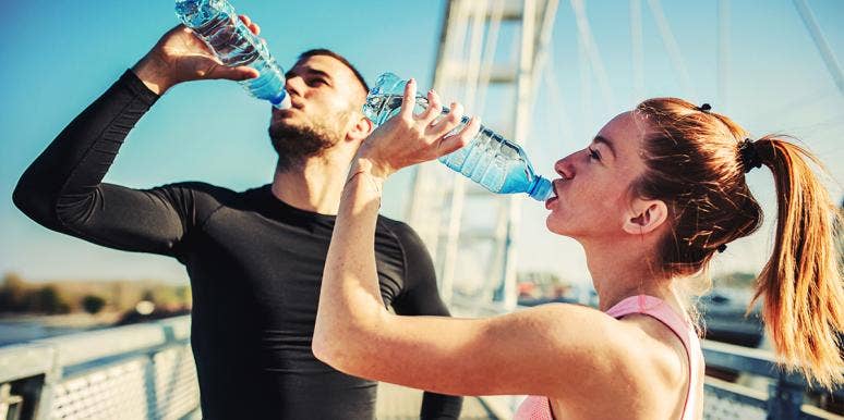 How Your Face Drastically Changes After 30 Days Of Drinking Water man and woman drinking water from bottles