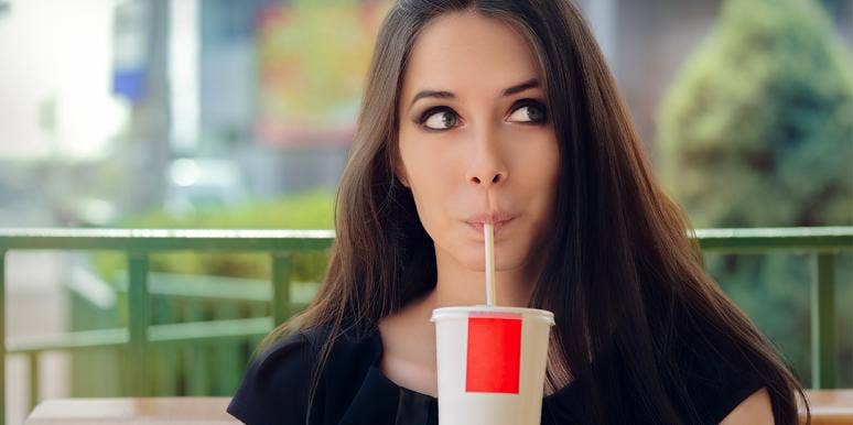 The Scary Disease You Can Get By Drinking Just One Soda A Day woman drinking soda