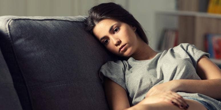 effects of a toxic relationship sad woman on couch thinking