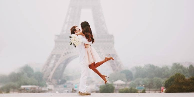 emotional trigger phrases for attraction couple hugging in front of the Eiffel tower