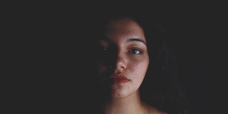emotional turmoil sad woman in the dark