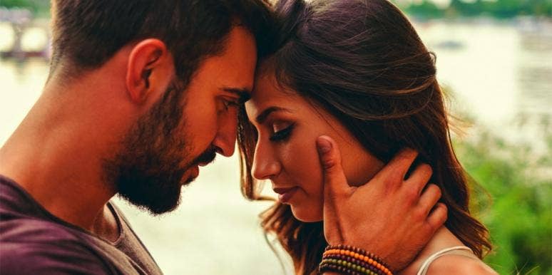 7 Signs Of Emotional Abuse That Look Like Love Couple pressing foreheads together emotionally