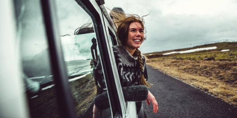 enneagram type nine happy woman in the car