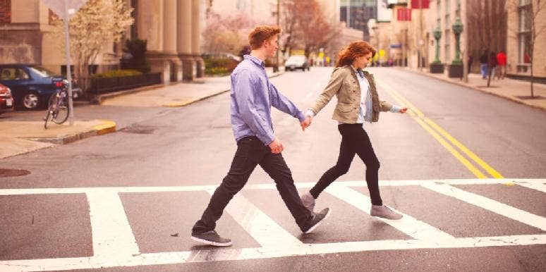 Enneagram Types In Love: How To Love Each Enneagram Type man holding woman's hand crossing the street