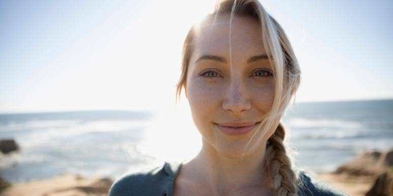enneagram wing smiling woman with the ocean behind her