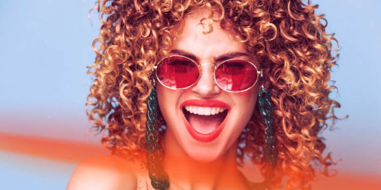 ESFP Personality Traits, Relationships & Careers woman laughing open mouth