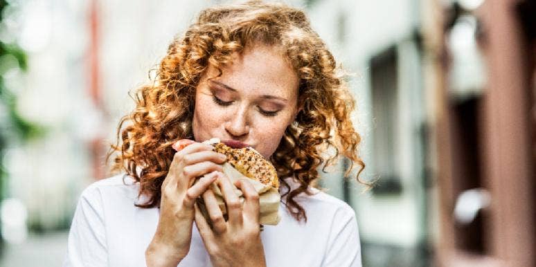 6 Foods You Should Be Eating If You Suffer From Estrogen Imbalance woman eating a bagel