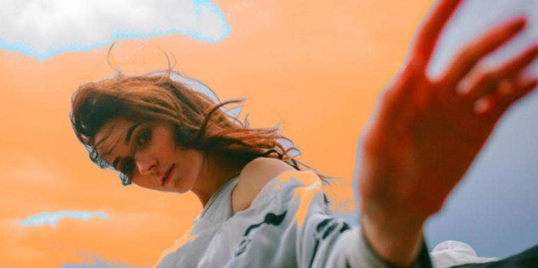 This Is Everything I Lost When I Lost You woman hand out orange background clouds