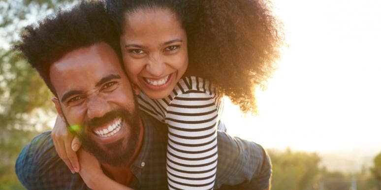 Why Getting Back With My Ex Was The Best Decision I Ever Made couple piggy back ride smiling
