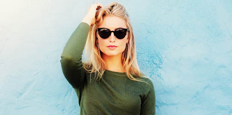 What to do if your ex won't move on blonde woman in sunglasses against a light blue wall