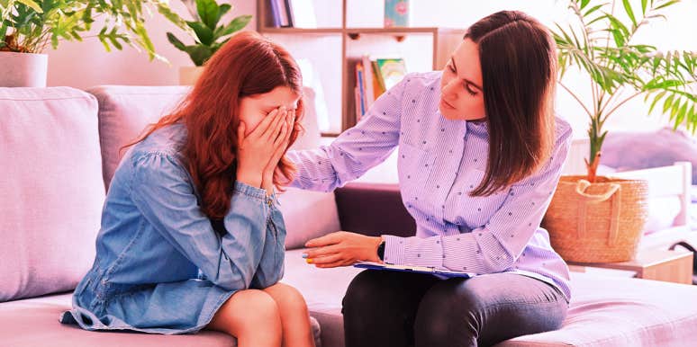 young girl upset talking to therapist