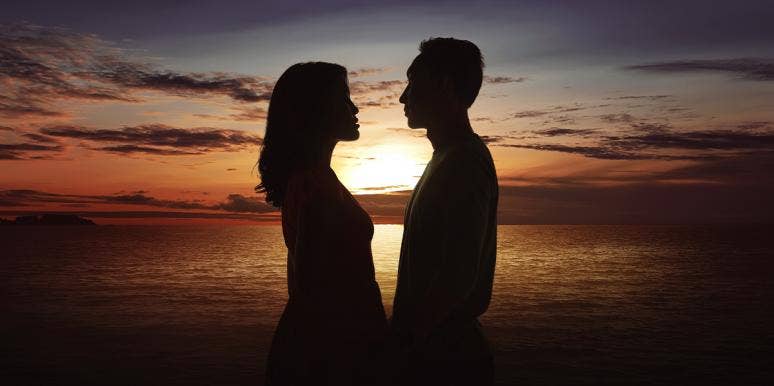 couple silhouette in front of the sunset