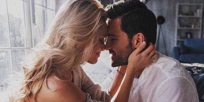 How Long It Actually Takes Men To Fall In Love couple touching their foreheads together