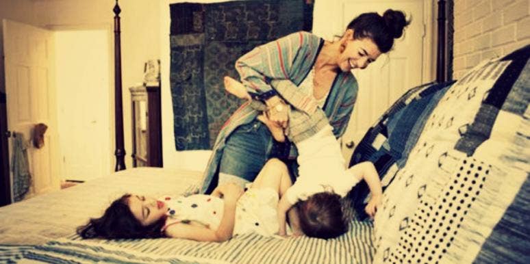 family playing on bed