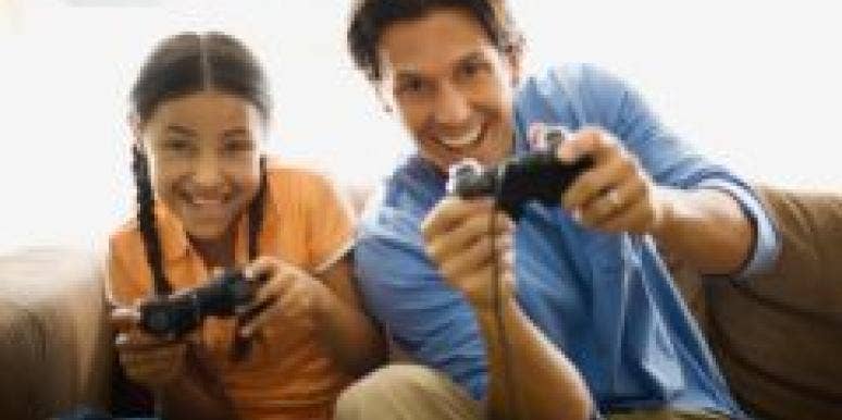 father and daughter playing video games