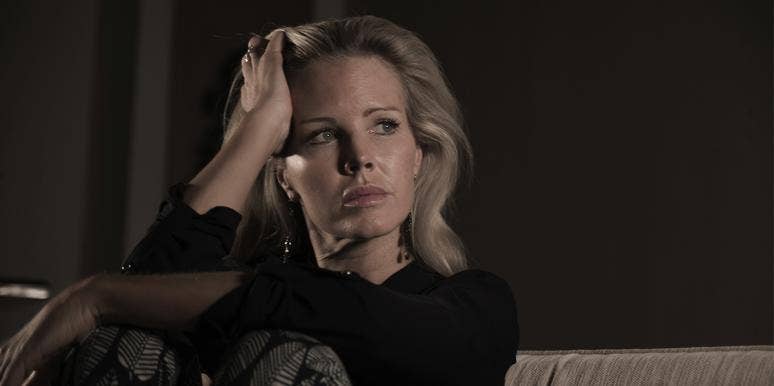 7 Things I Wish My Dad Knew About Me Before He Died woman with head in her hands looking away