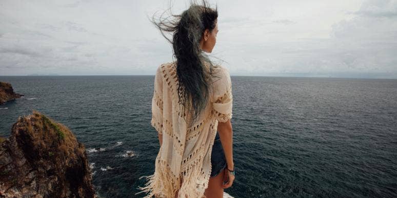 Why Being Fearless Is The Only Way To Love Again woman standing on a cliff