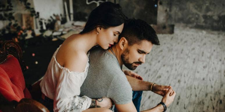 You Should Never Feel Like A Caretaker In Your Relationship woman holding onto emotionally checked out man