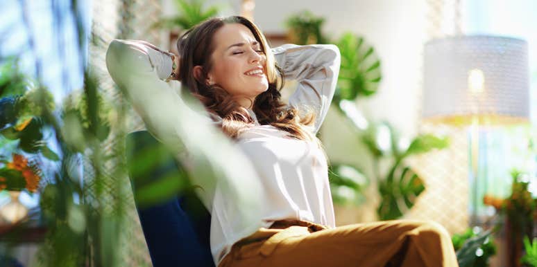 How Finding Awe In Everyday Things Can Ease Your Anxiety woman at peace