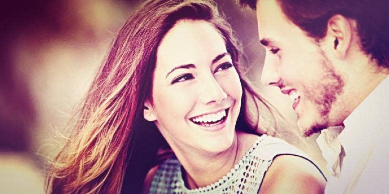 100 First Date Questions: What To Talk About On A First Date couple smiling looking at each other