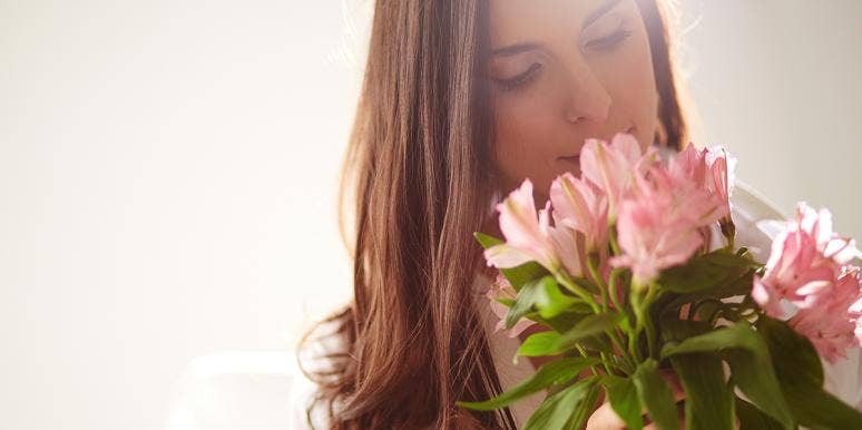 Why I Don't Like It When My Husband Buys Me Flowers woman with flowers