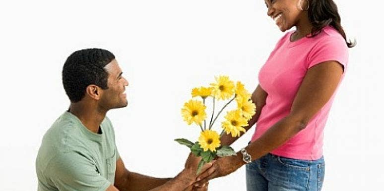 7 Things To Consider Before Getting Back Together With Your Ex guy giving a girl flowers