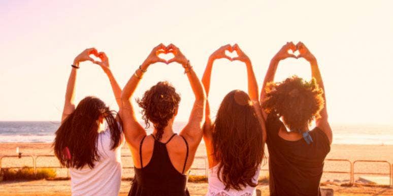 25 Best Galentine’s Day Gifts For Best Friends 2021 friends next to each other holding hearts