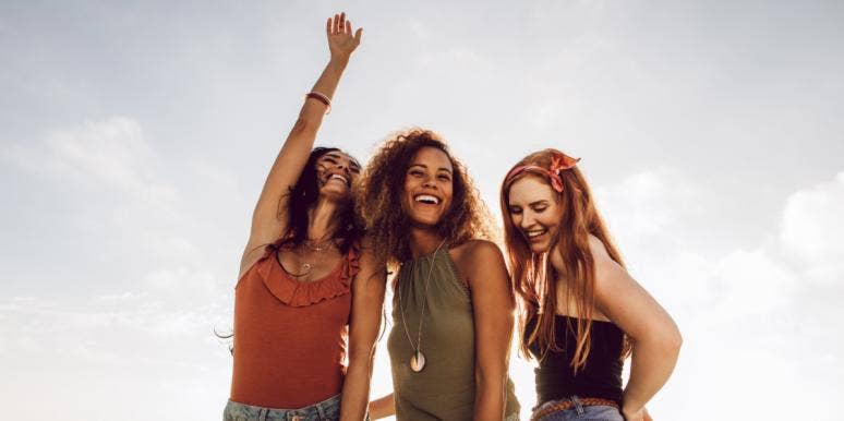 What Is Galentine’s Day? History & Origins Explained best friends laughing together