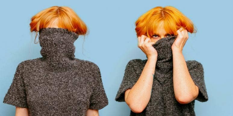 Gemini Compatibility In Love, Sex & Relationships ginger woman looking over a sweater