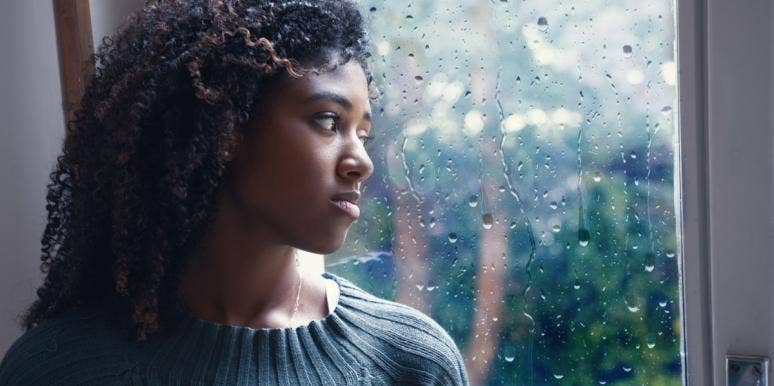 Why You Should Never Tell Someone To 'Get Over' Their Mental Illness woman looking out window rain