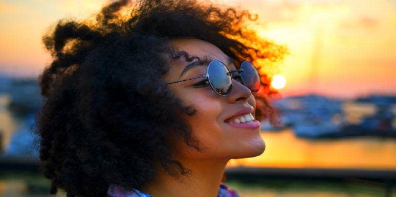 15 Men Explain What It Means To Be Girlfriend Material woman with sunglasses smiling