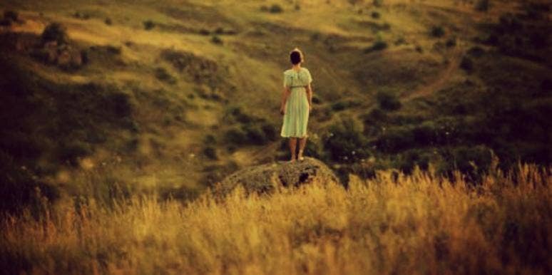 girl standing on the plains girl standing on the plains