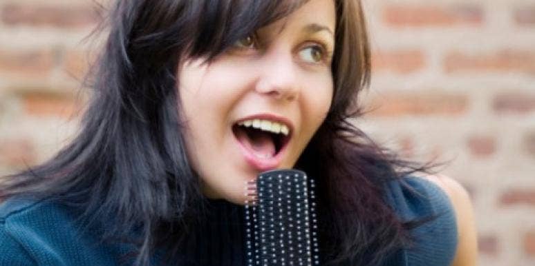 girl singing hairbrush