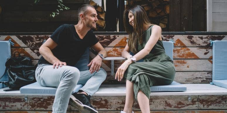 What To Do If Your Crush Isn't Picking Up On Your Signals man and woman flirting