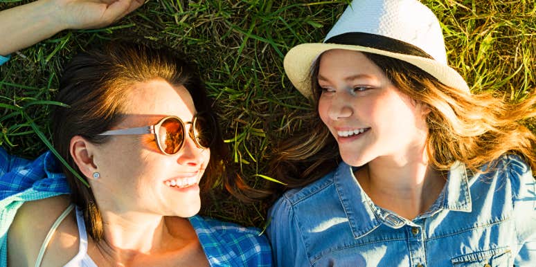 Give teens advice Mom and teen daughter relax outside