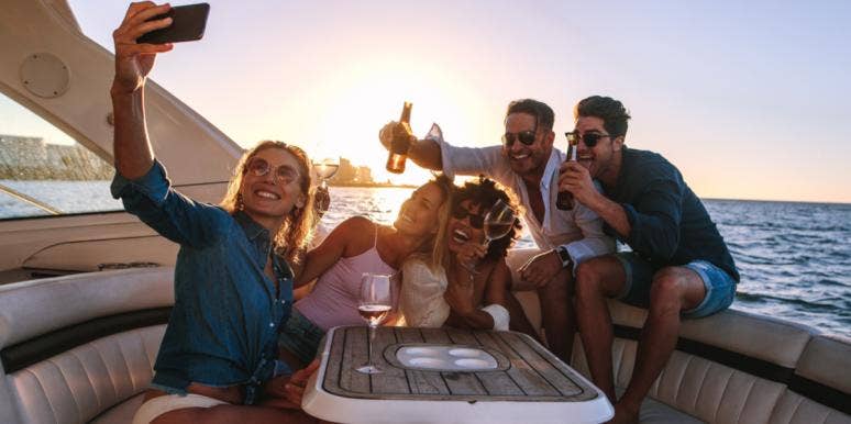 Enter To Win $1000 In Cash & Gift Cards In YourTango's Big Giveaway! partying on boat
