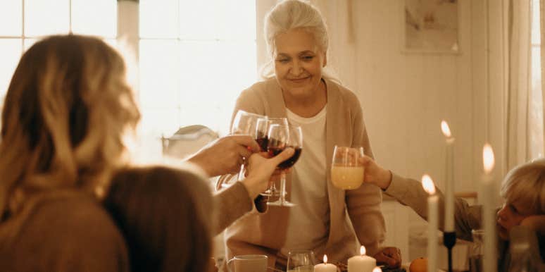 Woman Criticizes Friend's Mom For Having A Baby At 45 After Overhearing Her Shaming Her Friend Woman toasting dinner guests