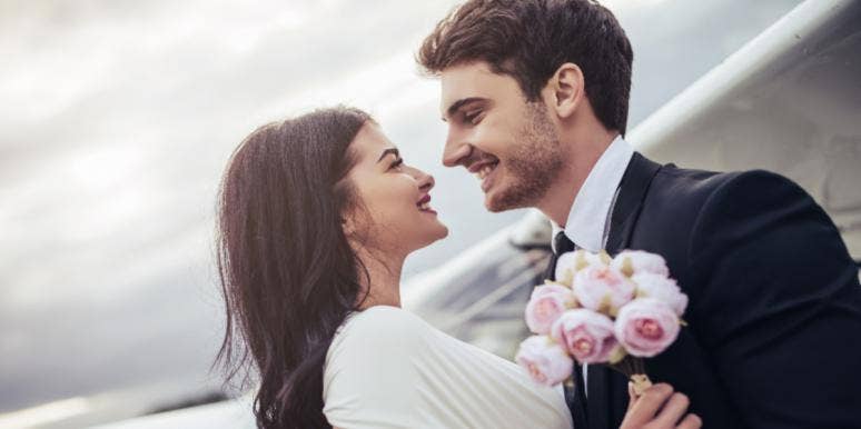 Groom Explains To Wife Why Video Shows Him Checking His Phone As She Walks Down The Aisle married couple at wedding